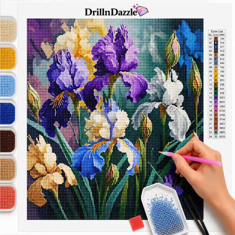 A diamond painting or cross-stitch style floral artwork sheet showing iris flowers, with a hand holding a pink tool and a color list printed on the right. The brand name DrillnDazzle appears at the top, and paint palette swatches are shown along the left side.