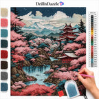 A diamond painting or cross-stitch style scenic artwork showing a Japanese landscape with cherry blossoms, mountains, a river, pagoda, and a hand holding a paint brush. The image includes a color list chart on the right and swatches of available colors on the left, with the brand name DrillnDazzle at the top.