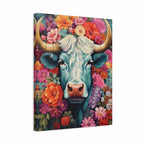 A square canvas wall art print featuring a stylized blue cow surrounded by a dense, colorful floral background, shown at a slight angle against a plain white backdrop.