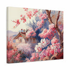 A square canvas wall art print depicting a soft, impressionistic landscape with pink and white blossoms, tree branches, a small house, and blue-purple foliage. The canvas is shown at a slight angle against a plain white background.