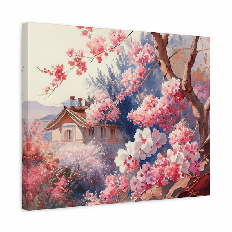 A square canvas wall art print depicting a soft, impressionistic landscape with pink and white blossoms, tree branches, a small house, and blue-purple foliage. The canvas is shown at a slight angle against a plain white background.