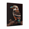 A vertical canvas wall art print featuring a stylized kookaburra perched on a branch against a dark brown background. The bird has a blue and orange beak and intricate brown, white, and teal patterned feathers.