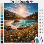 DrillInDazzle diamond painting kit showing a coastal landscape design with mountains, beach, ocean, and wildflowers. The image includes a color list on the right and a vertical row of color swatches on the left, with a paintbrush and small accessory pieces shown at the bottom right.