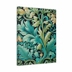 A vertical canvas wall art print featuring a classic William Morris-style botanical pattern with teal, green, and gold leaves and flowers on a black background, shown at a slight angle against a plain white studio backdrop.