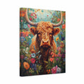 A vertical canvas wall art print featuring a stylized Highland cow surrounded by a colorful field of flowers, shown at a slight angle against a plain white background.