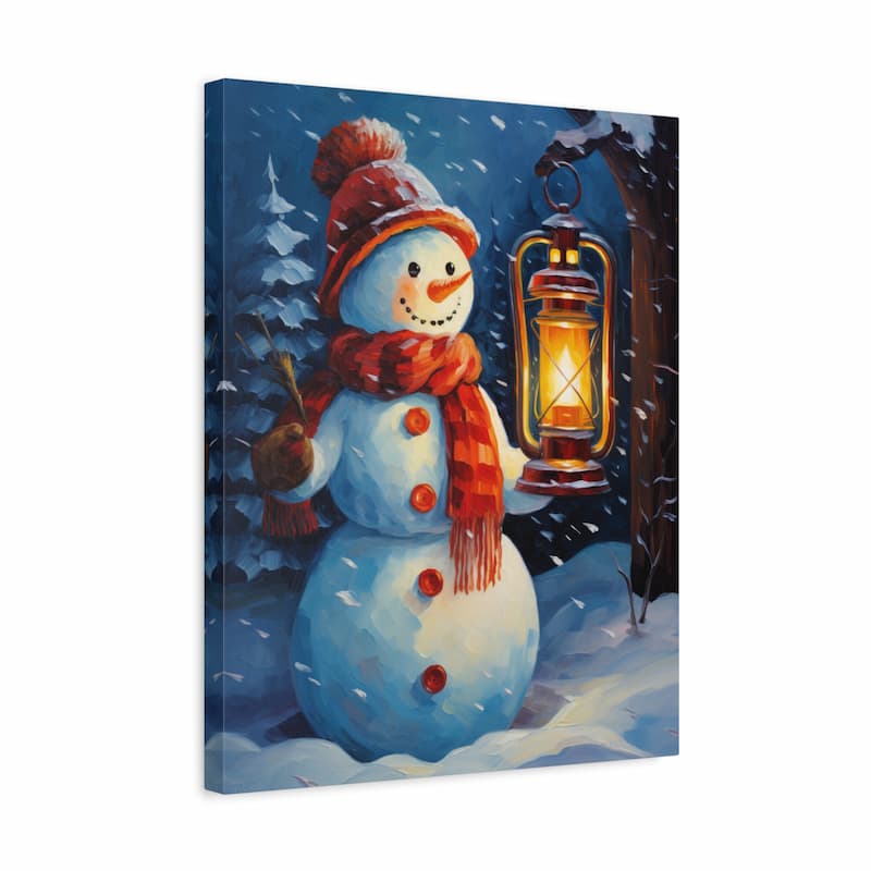 A square canvas wall art print depicting a winter snowman scene. The snowman wears a red hat and scarf, holding a glowing lantern, set against a snowy landscape with pine trees under a dark blue night sky.