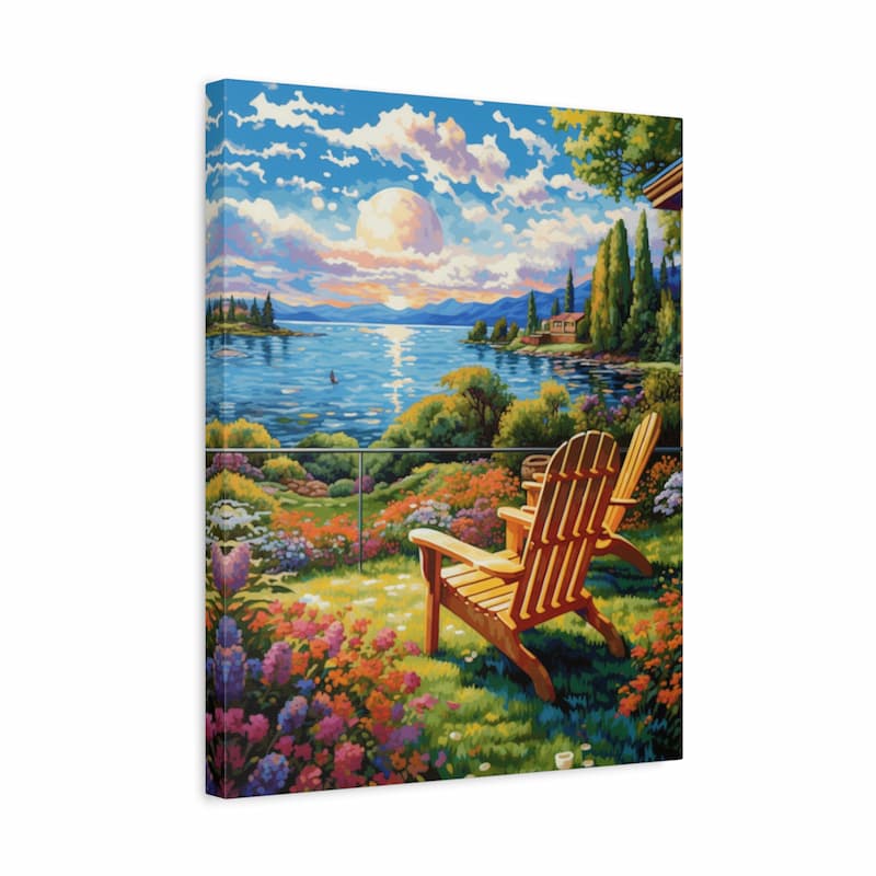 A rectangular canvas wall art print showing a colorful lakeside garden scene with two wooden Adirondack chairs in the foreground, flowers, trees, water, and a dramatic sunlit sky. The canvas is photographed at a slight angle against a plain white background.