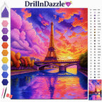 A colorful diamond painting style art kit cover showing a Paris Eiffel Tower scene with a bright sunset sky, river reflection, and a color palette strip on the left. The brand name DrillnDazzle appears at the top with a small swatch chart and instruction-style swatches on the right.