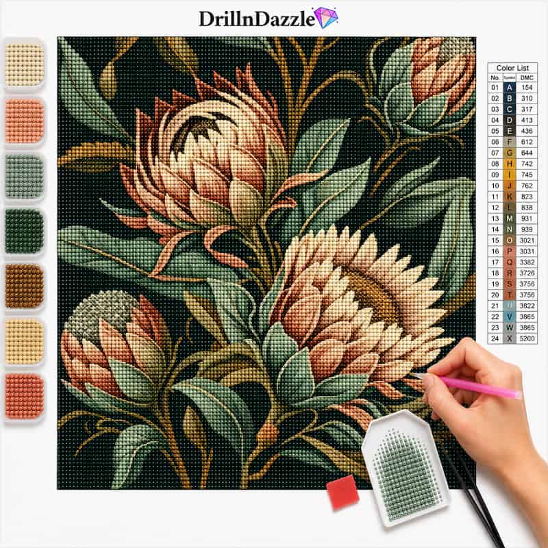 A diamond painting or cross-stitch style floral design on a white background, showing a hand holding a pink paint pen over the canvas. The artwork features large cream and peach protea flowers with green and brown leaves on a black ground.