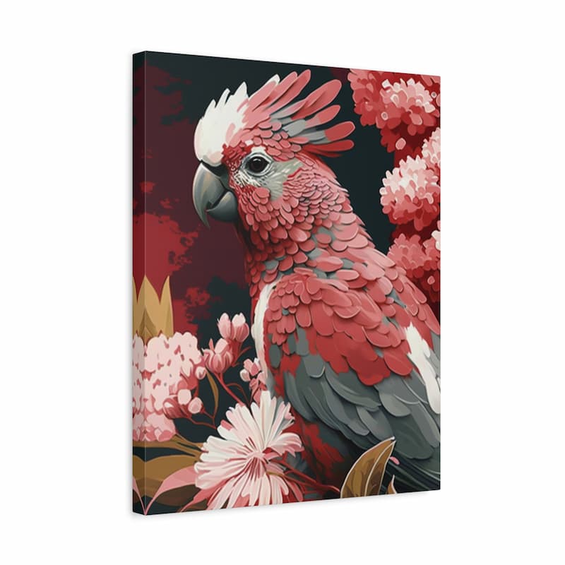 A square canvas wall art print featuring a stylized pink and red cockatoo surrounded by pink flowers on a dark background, shown at a slight angle against a white studio backdrop.