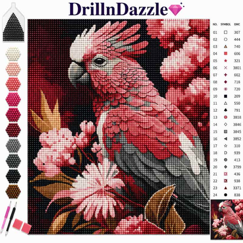 DrillnDazzle diamond painting kit featuring a pink and white cockatoo with pink flowers on a black background, complete with a color chart, symbols, and paintbrushes.