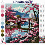 DrillInDazzle diamond painting kit featuring a cherry blossom landscape with a red arched bridge over water, shown with a color chart, swatches, and tools on a white background.