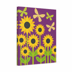 A rectangular wall art print or canvas featuring a stylized floral design with yellow sunflowers, green leaves, and light yellow butterflies on a purple background, shown at a slight angle against a white backdrop.