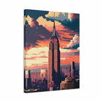 A vertical canvas wall art print featuring a stylized city skyline with the Empire State Building under a dramatic orange, pink, and blue sunset sky, shown at a slight angle on a white background.