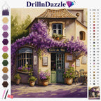 A cross-stitch or diamond painting style artwork preview showing a quaint house with purple flowering vines and potted plants. The image includes a brand header 'DrillnDazzle' at the top, a vertical row of color swatches on the left, a numbered color reference chart on the right, and a small finished artwork inset at the bottom right.