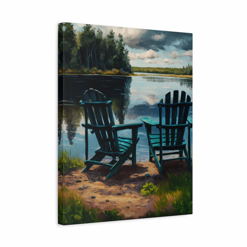 A square canvas wall art print depicting two teal Adirondack chairs on a sandy lakeshore with a calm lake, trees, and a cloudy sky. The canvas is shown at a slight angle against a plain white background.