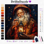 DrillnDazzle diamond painting kit featuring a festive Santa Claus design. The kit includes a color list on the right, a vertical row of paint swatches on the left, and accessories like a sorting tray, wax pad, and needles at the bottom right.