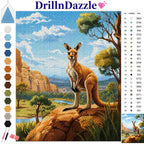 A completed diamond painting style landscape artwork showing a kangaroo standing on a rock by a river, with a color chart and brand name DrillInDazzle visible on the image.