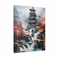 A vertical canvas wall art print depicting an Asian-style pagoda surrounded by waterfalls, misty mountains, and autumn foliage in red, orange, and green tones, shown at a slight angle against a white background.