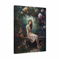 A square canvas wall art print showing a seated woman in a floral dress surrounded by lush roses and dark foliage, photographed against a plain white background.