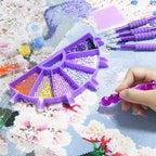Person using a diamond painting tool on a partially completed artwork with a purple frame.